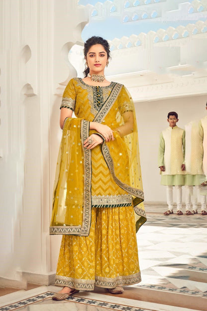 Exquisite yellow Heavy Embroidered Peplum Sharara Suit | Luxury Festive Wear | Kavlee