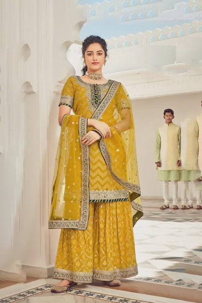 Exquisite yellow Heavy Embroidered Peplum Sharara Suit | Luxury Festive Wear | Kavlee